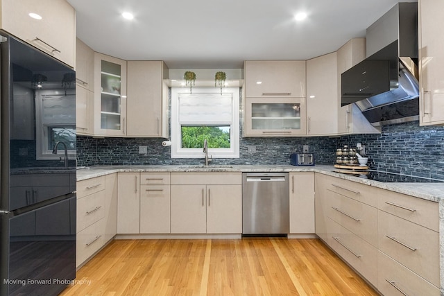 1145 S Chestnut Ave, Arlington Heights, IL 60005 - kitchen with black appliances, light wood finished floors, tasteful backsplash, light stone counters, and glass insert cabinets