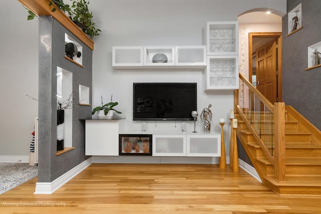 1145 S Chestnut Ave, Arlington Heights, IL 60005 - living area featuring arched walkways, wood finished floors, and stairway
