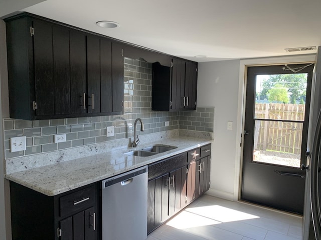 488 Fairview Dr Unit 0, Manhattan, IL 60442 - kitchen with dishwasher, dark cabinets, decorative backsplash, and light stone counters