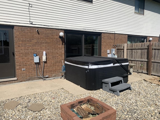 488 Fairview Dr Unit 0, Manhattan, IL 60442 - view of patio / terrace featuring a hot tub and an outdoor fire pit