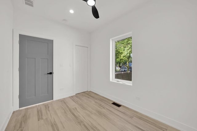 1444 W 49th Pl, Chicago, IL 60609 - unfurnished room with a ceiling fan, light wood finished floors, and recessed lighting