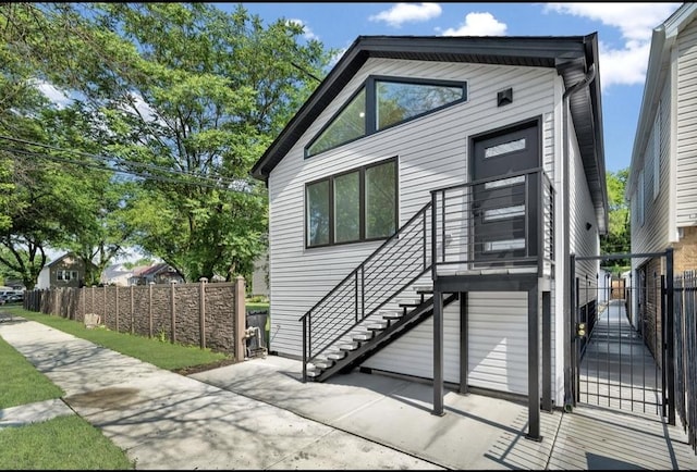 1444 W 49th Pl, Chicago, IL 60609 - view of front of property with a gate and stairway