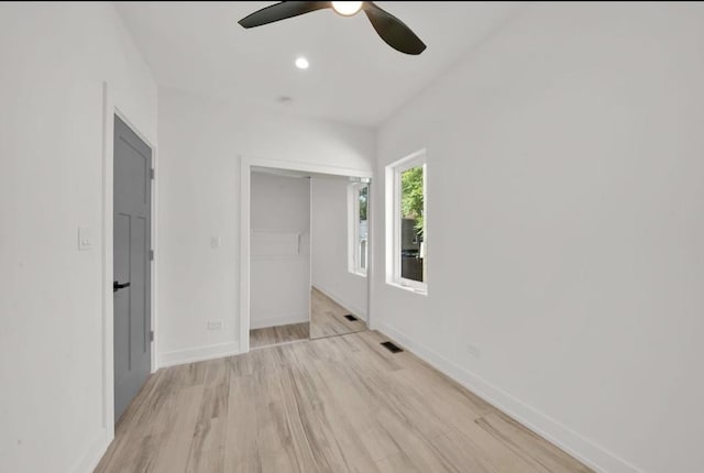 1444 W 49th Pl, Chicago, IL 60609 - unfurnished bedroom with light wood-style floors, a closet, a ceiling fan, and recessed lighting