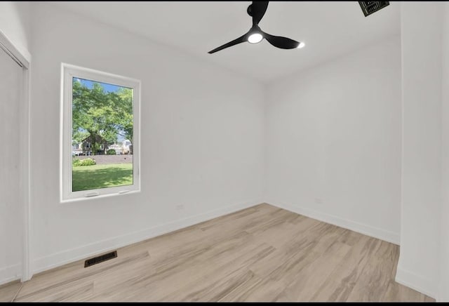 1444 W 49th Pl, Chicago, IL 60609 - empty room with ceiling fan and light wood-type flooring