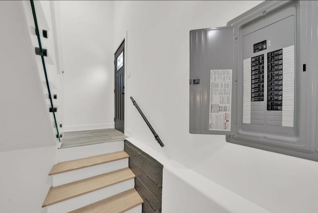 1444 W 49th Pl, Chicago, IL 60609 - staircase with electric panel and baseboards