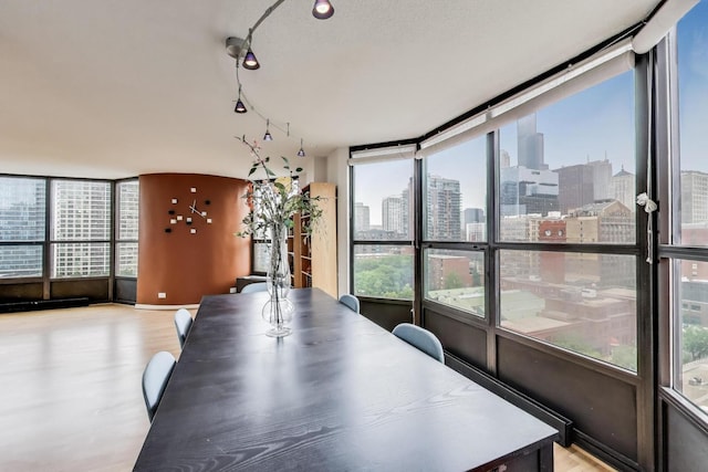 899 S Plymouth Ct Unit 1103, Chicago, IL 60605 - dining space with a view of skyline and wood finished floors