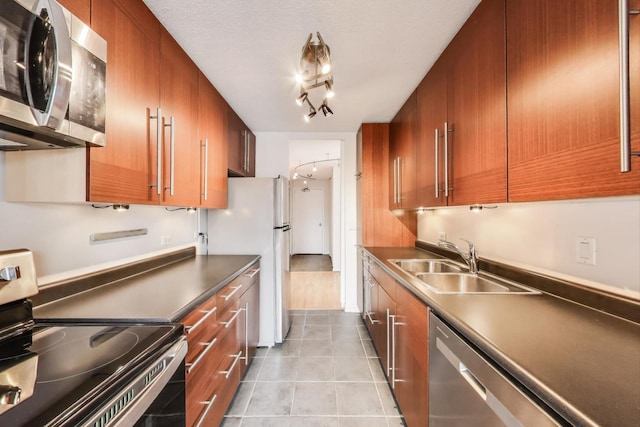 899 S Plymouth Ct Unit 1103, Chicago, IL 60605 - kitchen with appliances with stainless steel finishes, light tile patterned floors, brown cabinets, and dark countertops