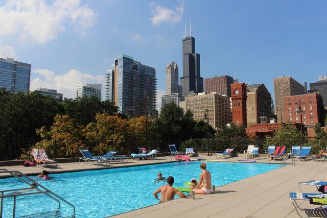 899 S Plymouth Ct Unit 1103, Chicago, IL 60605 - community pool with a patio area and a skyline view
