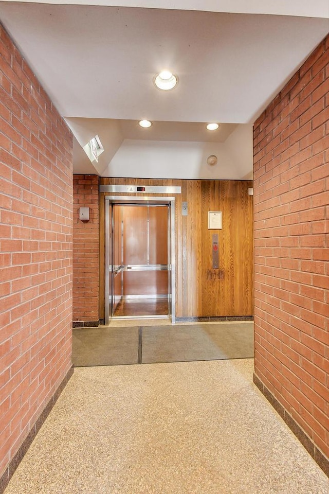 899 S Plymouth Ct Unit 1103, Chicago, IL 60605 - corridor with brick wall and recessed lighting