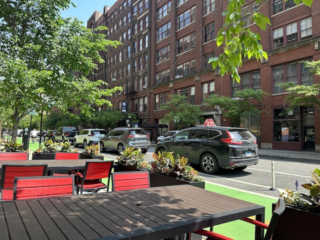 899 S Plymouth Ct Unit 1103, Chicago, IL 60605 - wooden deck featuring outdoor dining area