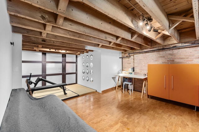 531 S Plymouth Ct Unit 602, Chicago, IL 60605 - basement with brick wall, light wood-style flooring, and wood ceiling