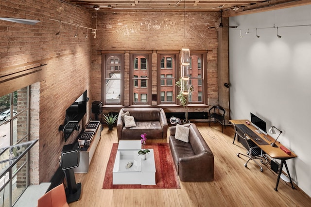 531 S Plymouth Ct Unit 602, Chicago, IL 60605 - sitting room with brick wall and wood finished floors