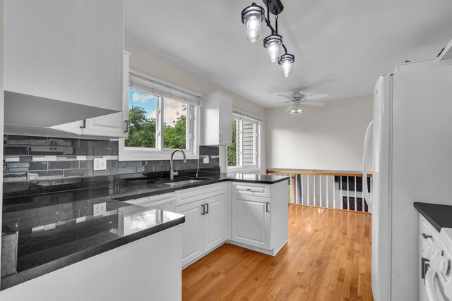 633 Buckthorn Ter, Buffalo Grove, IL 60089 - kitchen with freestanding refrigerator, ceiling fan, white cabinetry, and light wood finished floors