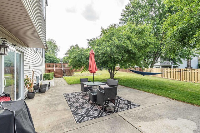 633 Buckthorn Ter, Buffalo Grove, IL 60089 - view of patio / terrace featuring a wooden deck and outdoor dining space