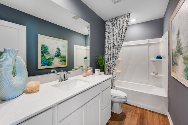 1701 Neubauer Cir, Lindenhurst, IL 60046 - bathroom with wood finished floors, vanity, and shower / bathtub combination