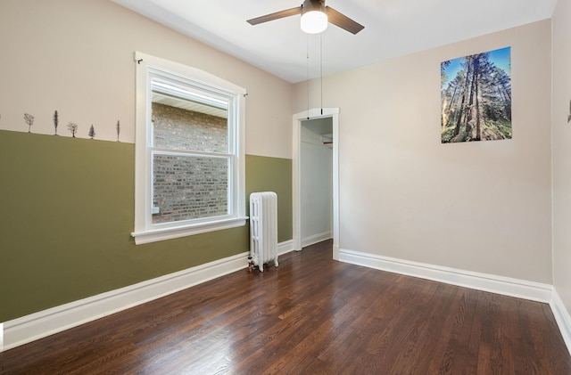 919 N Harvey Ave, Oak Park, IL 60302 - spare room featuring radiator heating unit, wood finished floors, and ceiling fan