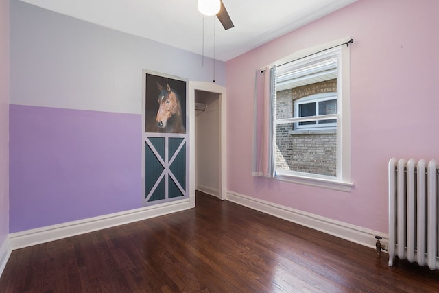 919 N Harvey Ave, Oak Park, IL 60302 - unfurnished room featuring radiator heating unit, wood finished floors, and a ceiling fan