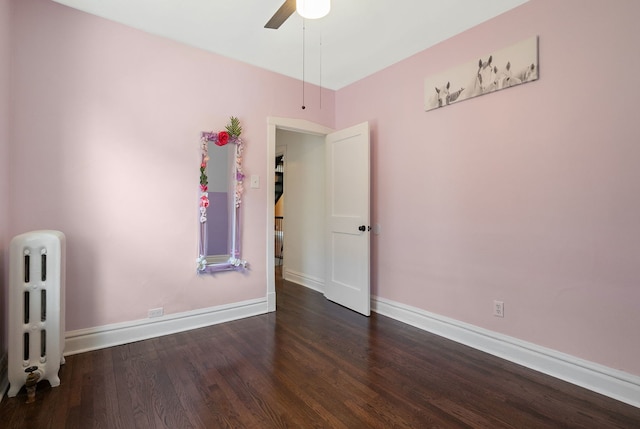 919 N Harvey Ave, Oak Park, IL 60302 - spare room featuring radiator, wood finished floors, and a ceiling fan