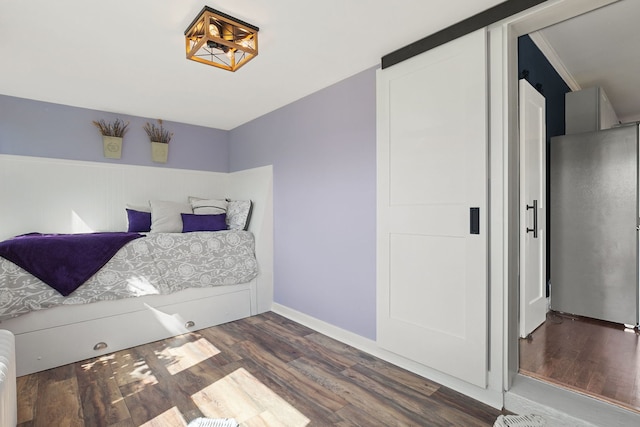 919 N Harvey Ave, Oak Park, IL 60302 - bedroom with wood finished floors and freestanding refrigerator