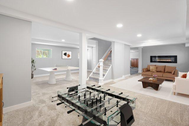 919 N Harvey Ave, Oak Park, IL 60302 - living room with carpet flooring, recessed lighting, stairway, and a glass covered fireplace