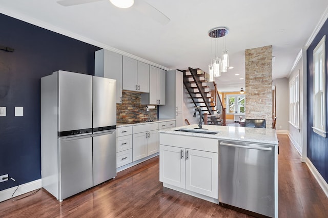919 N Harvey Ave, Oak Park, IL 60302 - kitchen featuring stainless steel appliances, tasteful backsplash, dark wood finished floors, and an island with sink