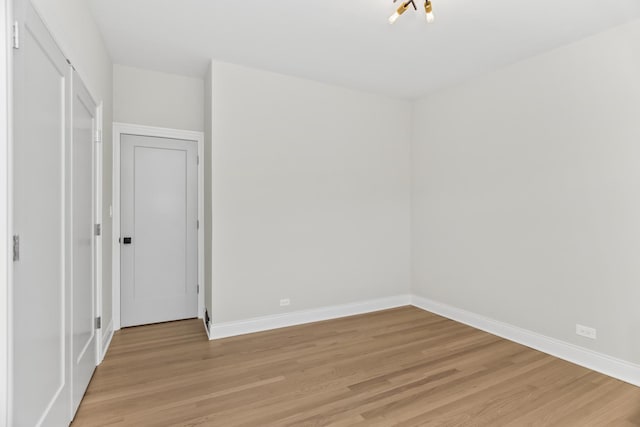319 Kilpatrick Ave, Wilmette, IL 60091 - spare room featuring light wood-style floors and baseboards