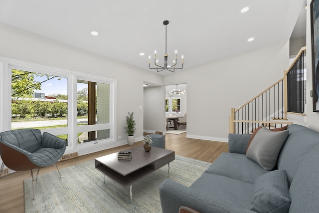 319 Kilpatrick Ave, Wilmette, IL 60091 - living room with a chandelier, plenty of natural light, wood finished floors, stairs, and recessed lighting