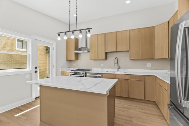 319 Kilpatrick Ave, Wilmette, IL 60091 - kitchen with stainless steel appliances, wall chimney range hood, light wood-style flooring, a center island, and decorative light fixtures
