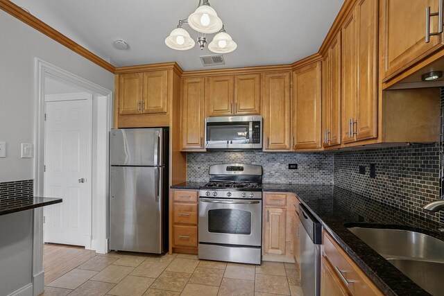 11114 Heritage Dr Unit 3C, Palos Hills, IL 60465 - kitchen featuring stainless steel appliances, backsplash, and dark stone countertops