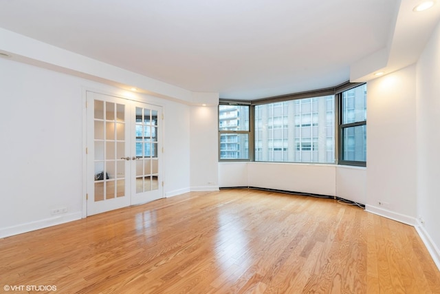 535 N Michigan Ave Unit 2203-2204, Chicago, IL 60611 - unfurnished room featuring wood finished floors and french doors