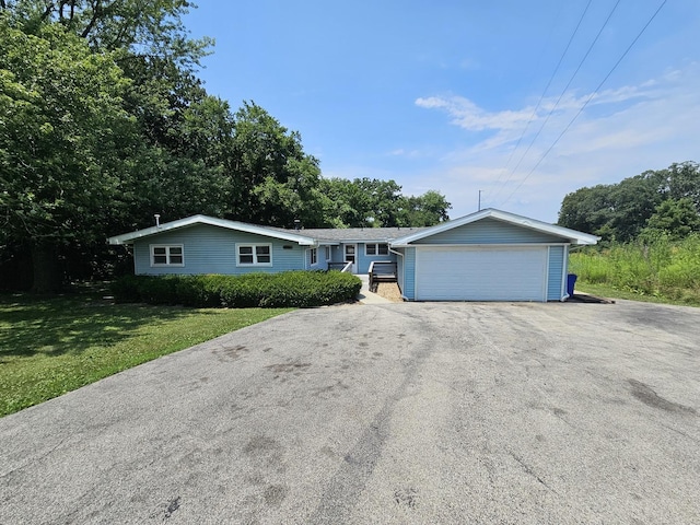 2875 N Vine St, Decatur, IL 62526 - ranch-style home featuring a detached garage and a front yard