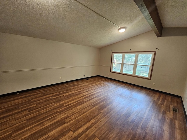 2875 N Vine St, Decatur, IL 62526 - empty room with dark wood finished floors and a textured ceiling