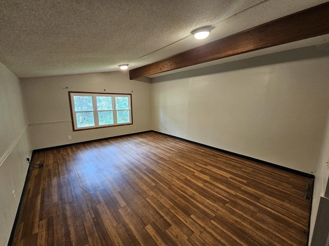 2875 N Vine St, Decatur, IL 62526 - unfurnished room with dark wood-style flooring, a textured ceiling, and beamed ceiling