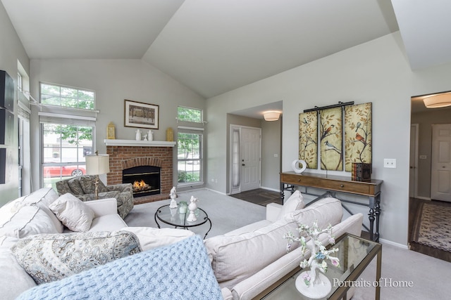 30W075 Willow Ln Unit 0, Warrenville, IL 60555 - carpeted living area with a fireplace and high vaulted ceiling