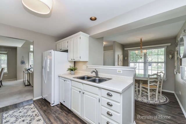 30W075 Willow Ln Unit 0, Warrenville, IL 60555 - kitchen featuring white appliances, a peninsula, light countertops, dark wood-style flooring, and white cabinetry
