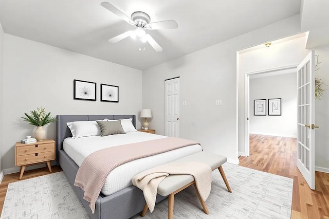 1301 E 71st Pl Unit 2S, Chicago, IL 60619 - bedroom featuring light wood-type flooring, ceiling fan, and french doors