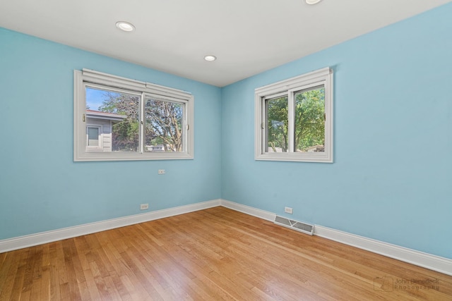 330 N Country Club Dr, Addison, IL 60101 - empty room featuring plenty of natural light, light wood finished floors, and recessed lighting