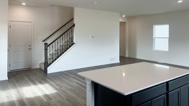 5049 Linden Rd, Mount Pleasant, WI 53403 - kitchen with wood finished floors, recessed lighting, light stone countertops, and a center island