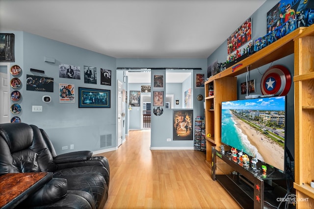 2426 Courtyard Cir Unit 3, Aurora, IL 60506 - living room featuring wood finished floors and baseboards