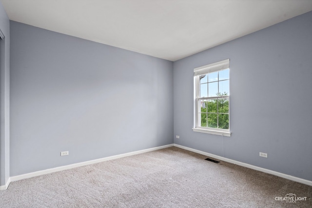 2426 Courtyard Cir Unit 3, Aurora, IL 60506 - unfurnished room featuring baseboards and carpet flooring