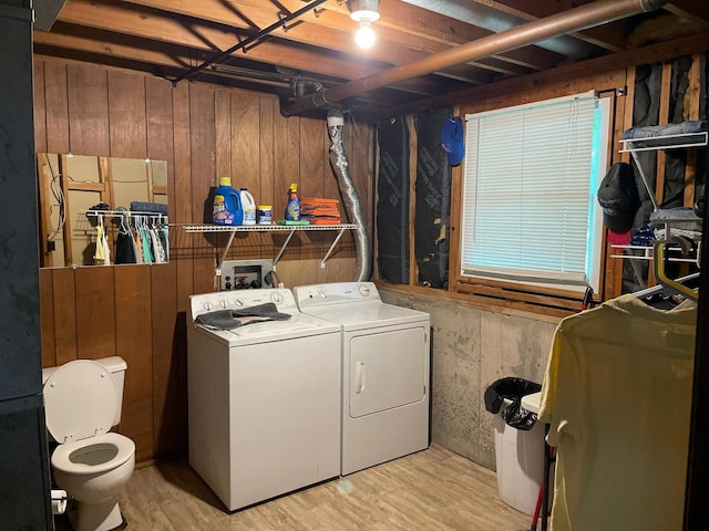 112 Crestview Dr, Hamilton, IL 62341 - washroom featuring washer and dryer, light wood finished floors, and wooden walls