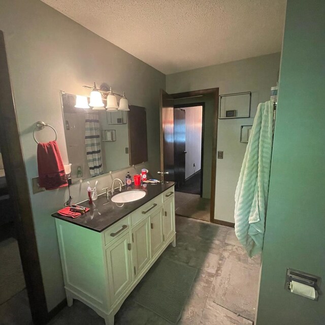 112 Crestview Dr, Hamilton, IL 62341 - bathroom with a textured ceiling and vanity