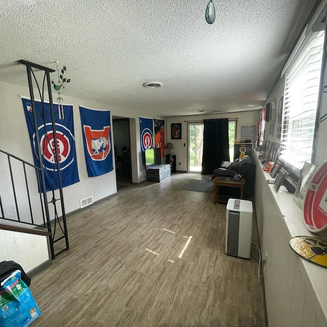 112 Crestview Dr, Hamilton, IL 62341 - living room featuring a textured ceiling and wood finished floors
