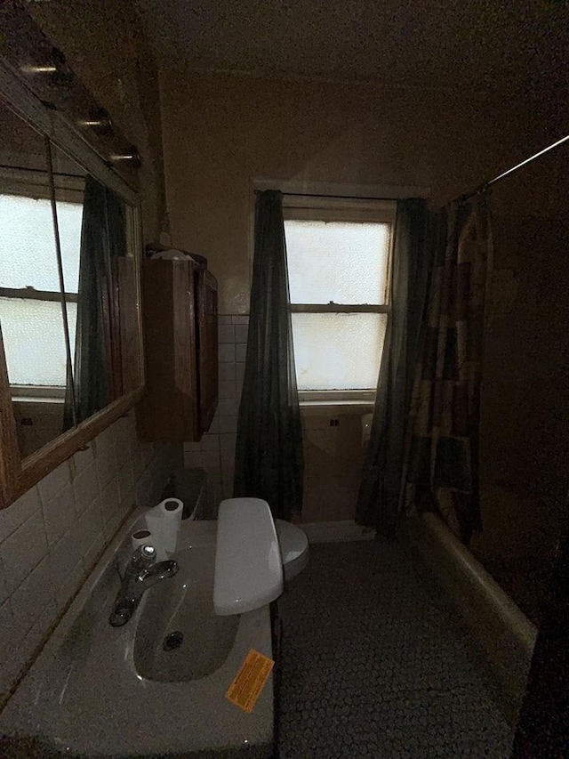 8427 S Peoria St, Chicago, IL 60620 - bathroom featuring toilet and tile walls