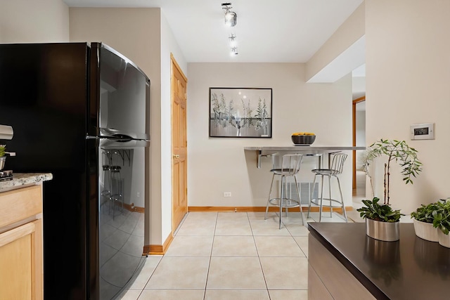 4825 W 109th St Unit 303, Oak Lawn, IL 60453 - kitchen featuring freestanding refrigerator and light tile patterned floors