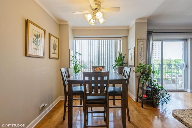 7033 N Kedzie Ave Unit 512, Chicago, IL 60645 - dining space featuring healthy amount of natural light, wood finished floors, a ceiling fan, and ornamental molding