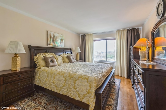 7033 N Kedzie Ave Unit 512, Chicago, IL 60645 - bedroom featuring light wood-style floors and ornamental molding