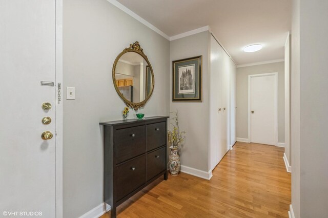 7033 N Kedzie Ave Unit 512, Chicago, IL 60645 - hallway featuring light wood-type flooring and crown molding
