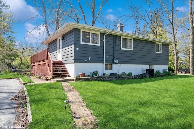 31 Medinah Ave, Fox Lake, IL 60020 - view of home's exterior with a chimney, a lawn, and stairway