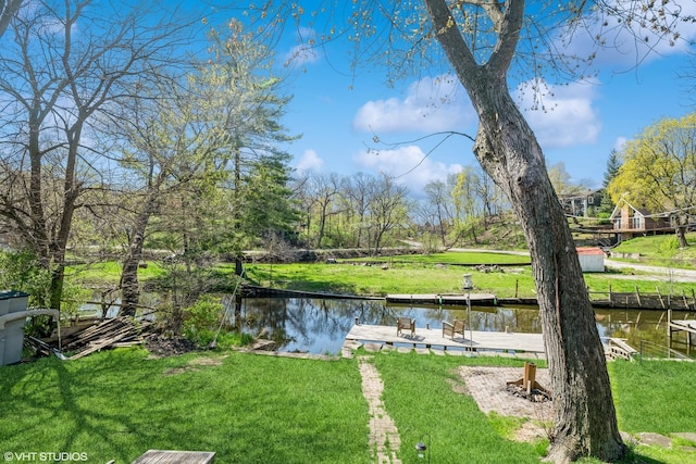 31 Medinah Ave, Fox Lake, IL 60020 - view of grassy yard with a water view and a dock